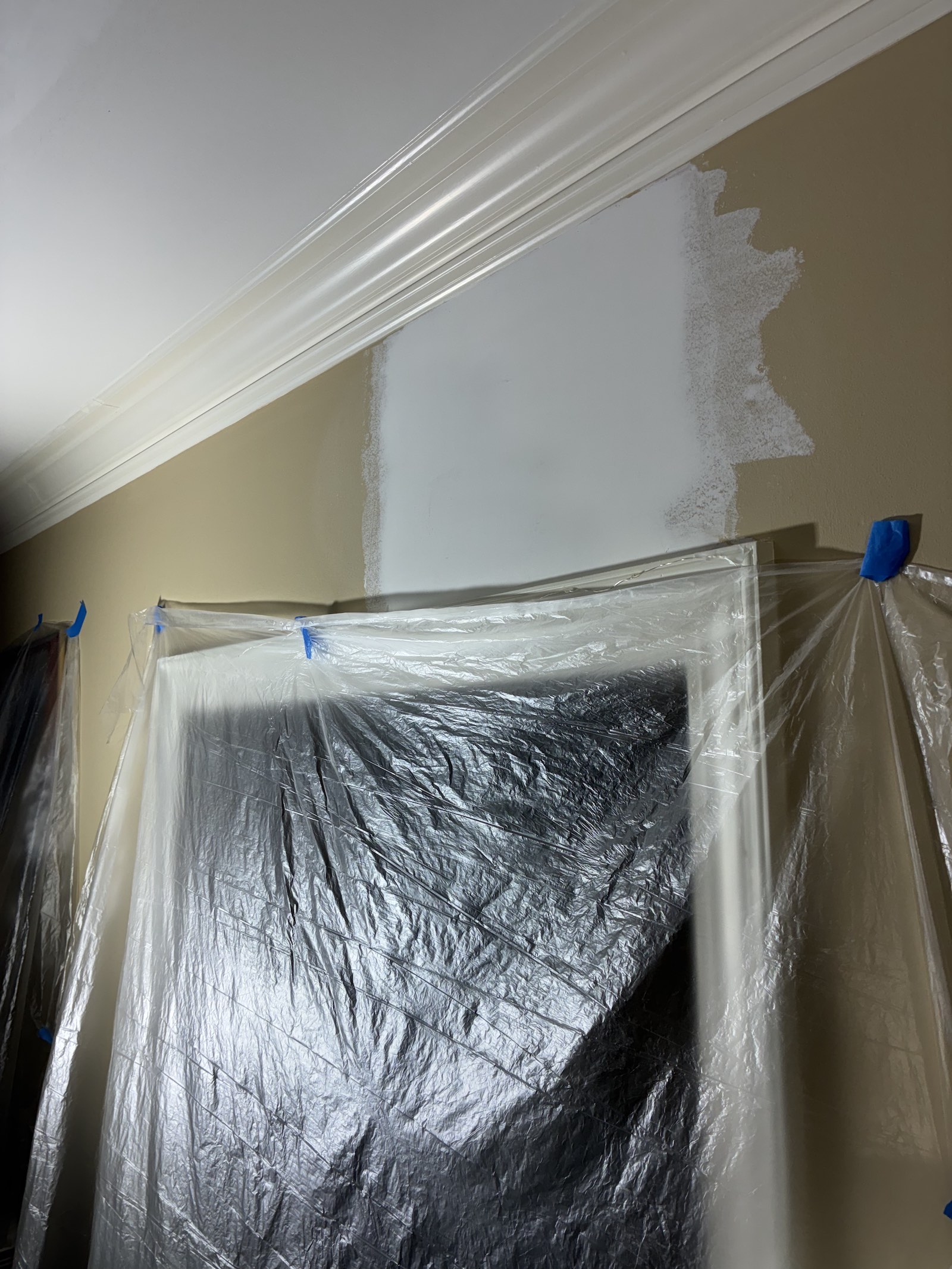 Finished drywall joint repair above a door sanded smooth before priming and painting