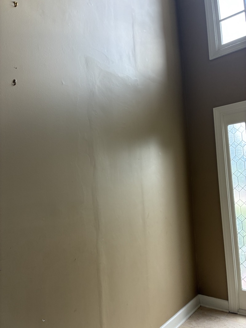Raised and uneven drywall patch that flashes under light