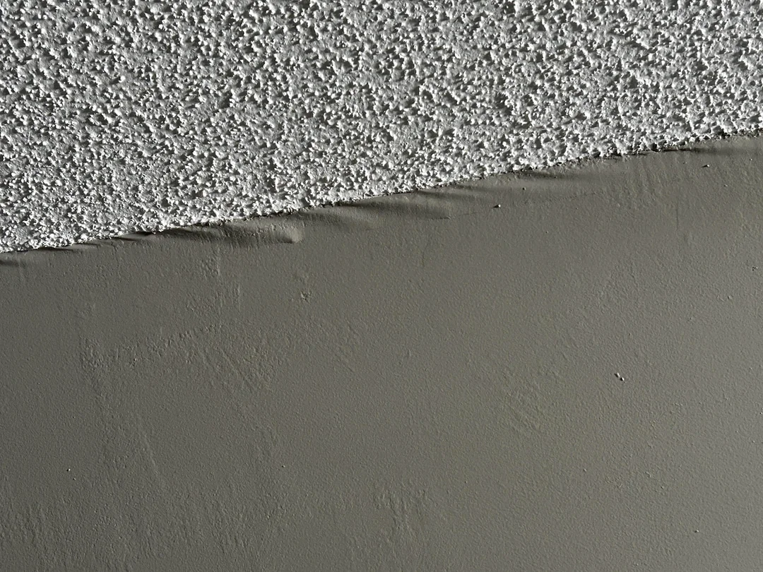 Bubbling drywall tape at an inside corner before repair