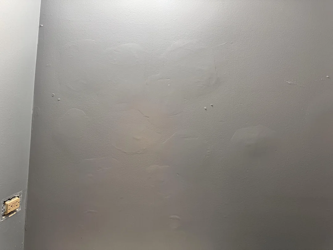 Wall with heavy inconsistent texture that needs skim coating before painting