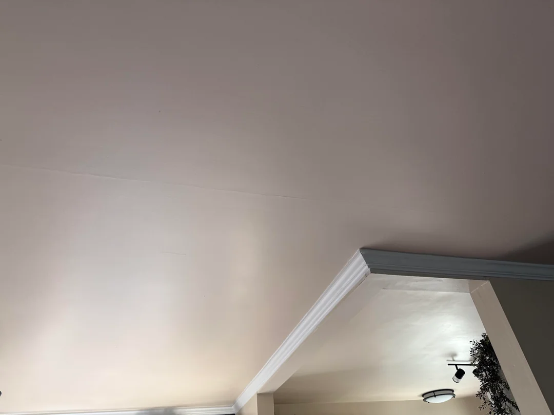 Ridge and uneven surface on a ceiling before skim coating and painting